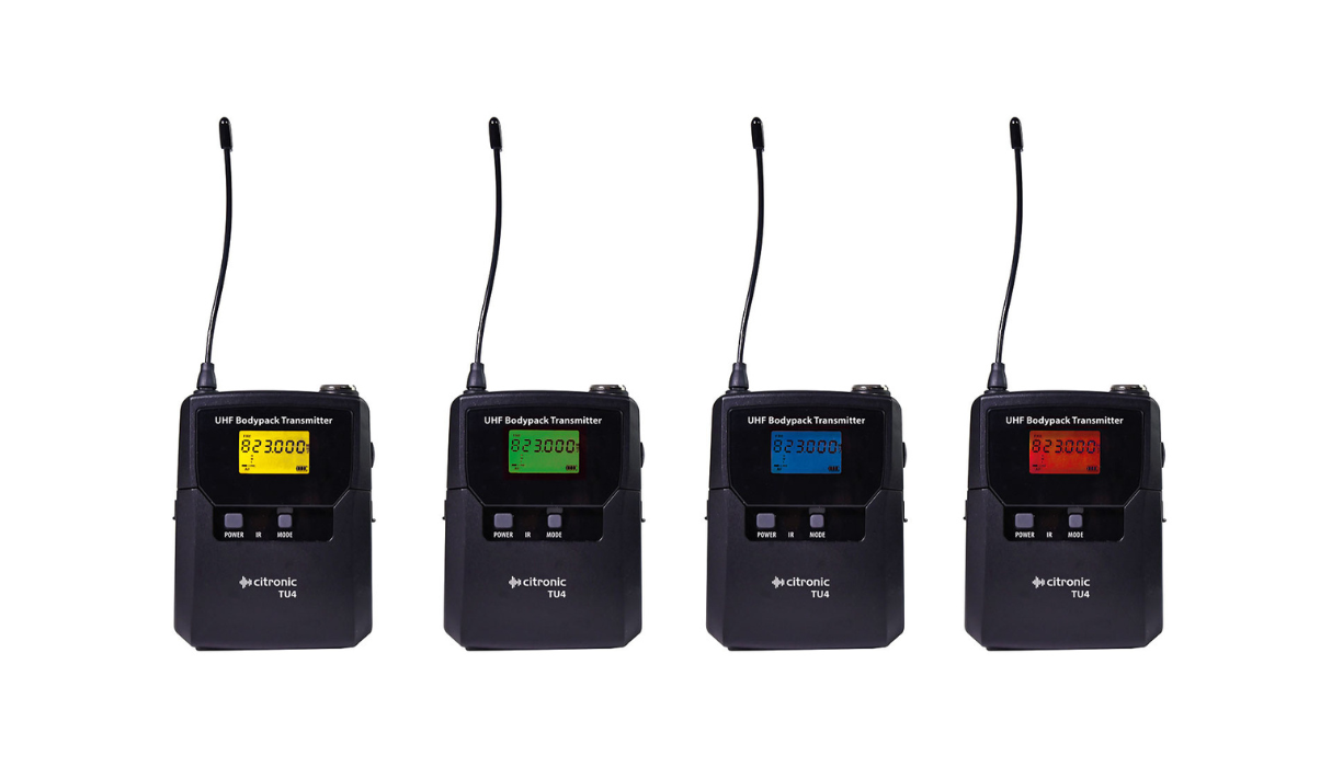 Close-up shot of four Bodypack Transmitters for a Quad PPL Microphone System with varying Digital LED Displays (Yellow, Green, Blue, Red)